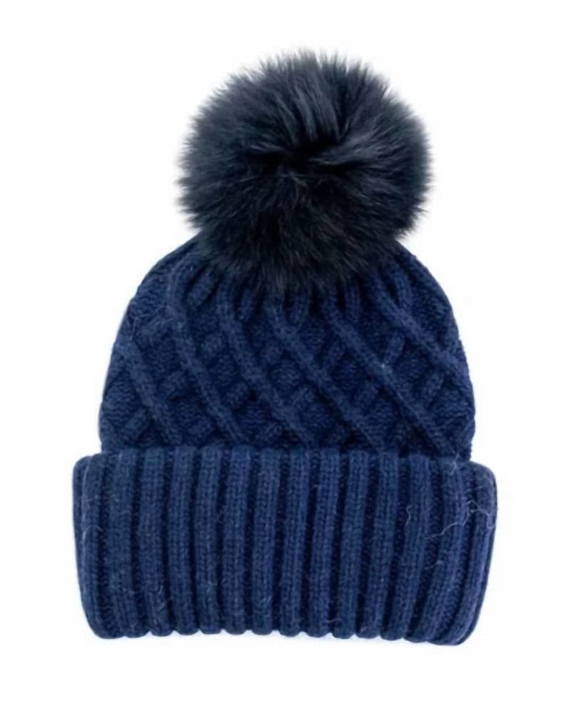 Front of a model wearing a size one-size-fits-all Knit Hat With Fur Pom In Navy in Navy by Mitchie's Matchings. | dia_product_style_image_id:358912